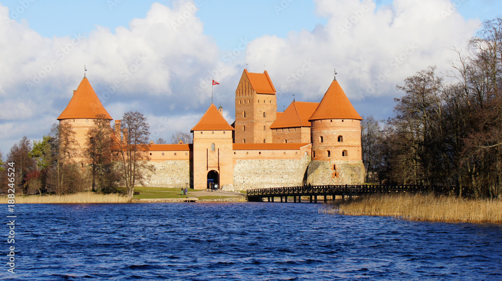 Beautiful scenic view of medieval brick Trakai castle across the lake, island ancient castle are one of the most popular touristic destination in Lithuania, sunny day