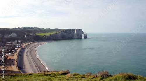 Beautiful aerial panoramic view of white chalk cliffs Aval, the needle rock and the stone arch, alabaster cliff bay and beach, sunny day, Etretat, Normandy, France