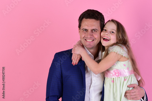 Girl and man with happy smiling faces on pink background