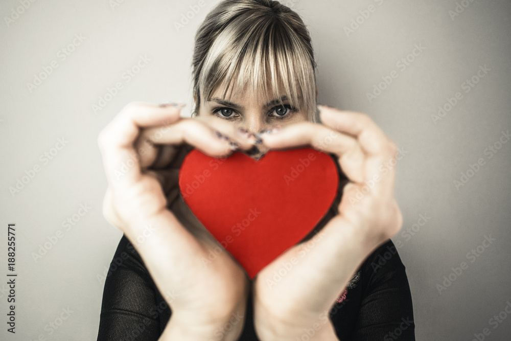 Beautiful girl holding paper heart Beautiful girl holding paper heart
