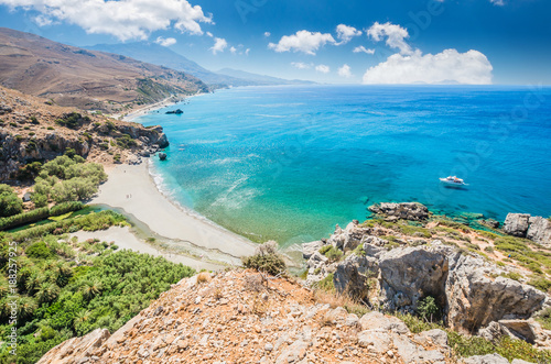 Preveli Beach in Crete island, Greece. There is a palm forest and a river inside the gorge near this beach.