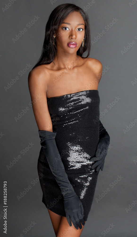 Beautiful Woman in Black Sequin Strapless Dress and Long Black Gloves Stock  Photo | Adobe Stock