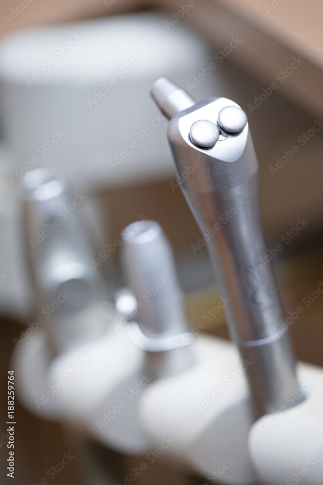 Close up on an array of pneumatic dental tools