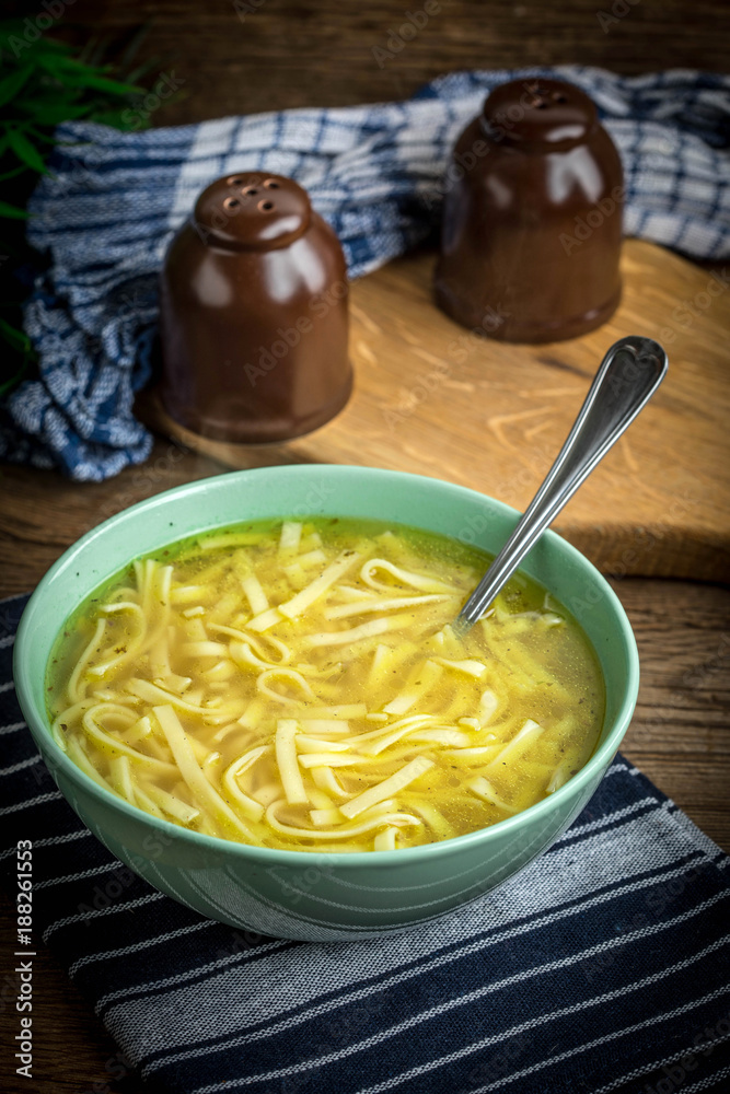 Broth - chicken soup in a bowl.