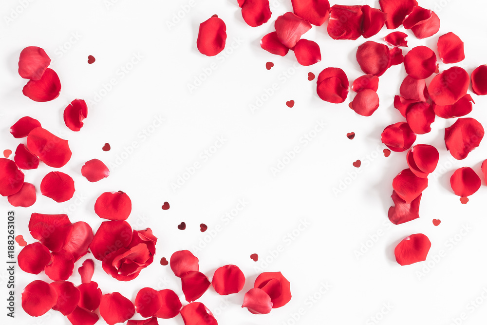 Flowers composition. Frame made of rose flowers, confetti on white background. Valentines day background. Flat lay, top view, copy space