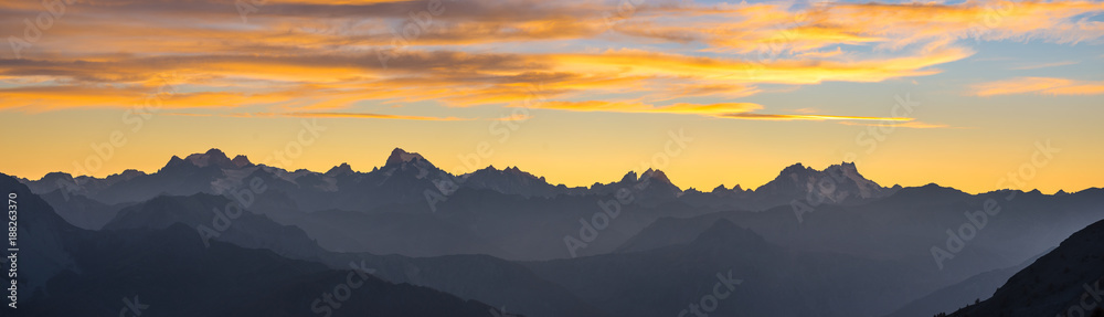 The Alps in Italy at sunset, famous travel destination in summertime. Ultra wide panoramic view