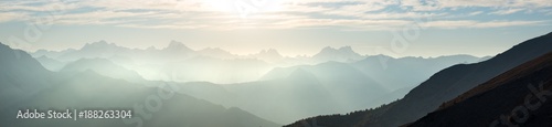 The Alps in Italy at sunset, famous travel destination in summertime. Ultra wide panoramic view
