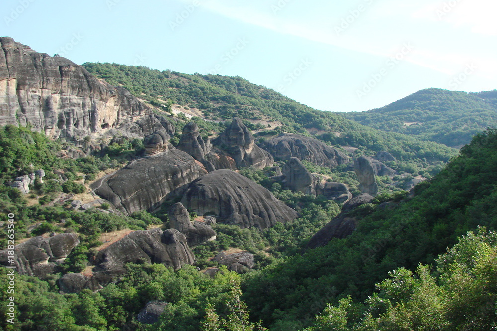landscape of the rocks of St. Meteors surrounded by mountain forests in the central part of Greece.