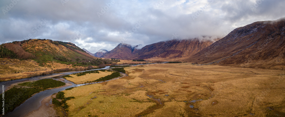 landscape view of scotland and glen etive in winter from an aerial viewpoint in panoramic landscape format