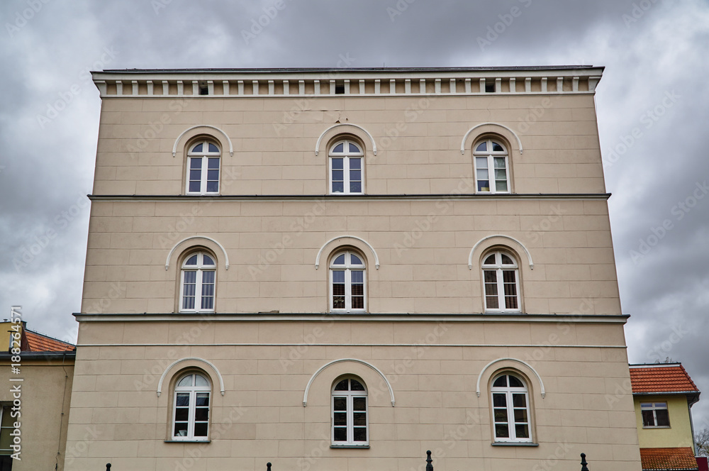 Facade of a classicist tenement house in the city of Gniezno.