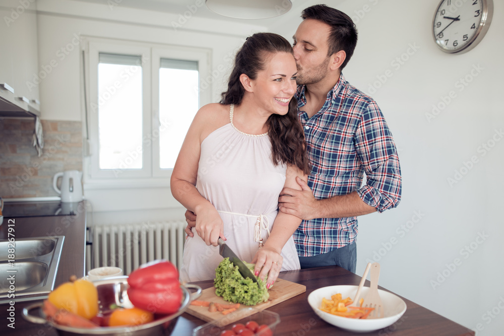 Young couple having fun from preparing food together. Young couple having fun from preparing food together.