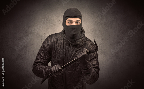 Burglar with tool.