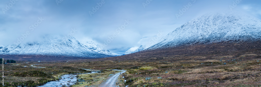landscape view of scotland and buchaille etive mor in glencoe in the remote highlands of scotland with snow capped peaks in winter