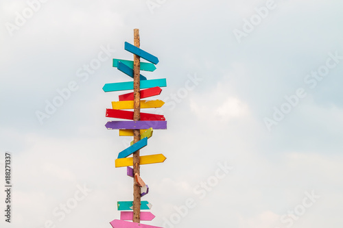Colorful wooden direction arrow signs photo