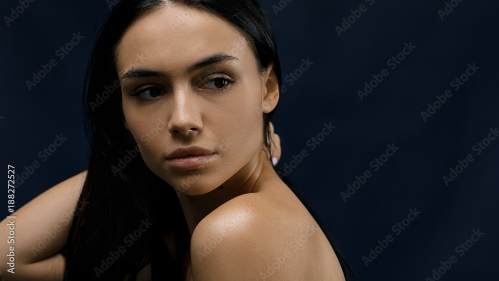 Beautiful brunette woman in studio, copy space Beautiful brunette woman in studio, copy space