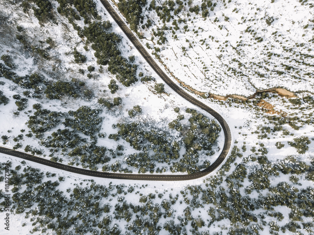 A hairpin turn in the snowy mountains.