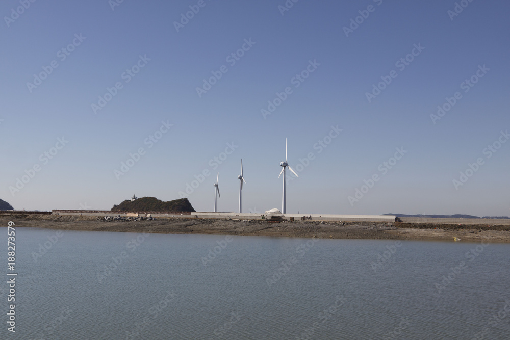 Wind generators and sea in Korea.