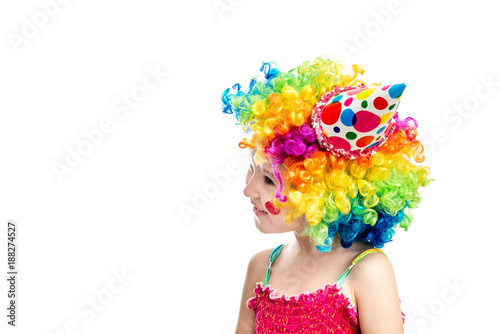 Little smiling girl dressed as a clown