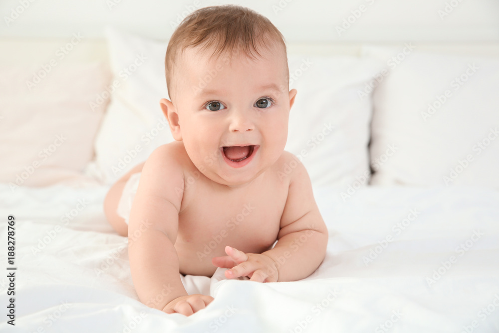 Cute little baby after bathing lying on bed at home Cute little baby after bathing lying on bed at home