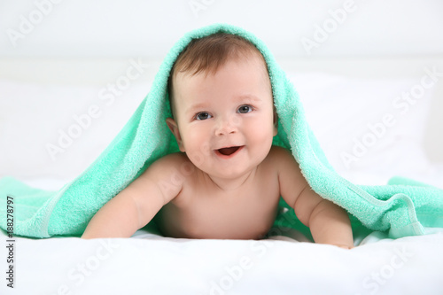 Cute little baby with towel...