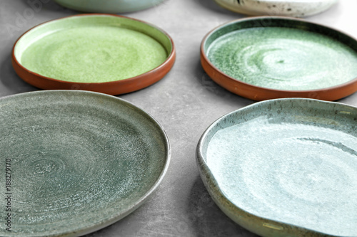 Ceramic plates on grey background