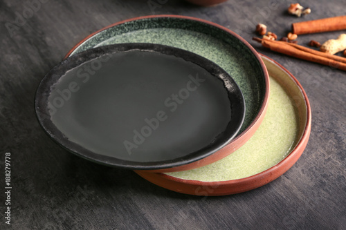 Ceramic plates on grey background