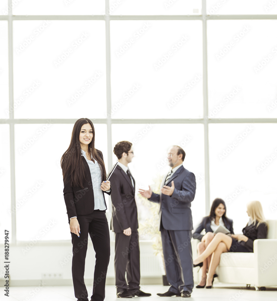 Manager of the company with documents on the background of the company's employees Manager of the company with documents on the background of the company's employees
