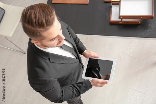 Young lawyer with tablet co...
