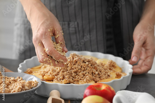 Photography Woman preparing apple crisp on table