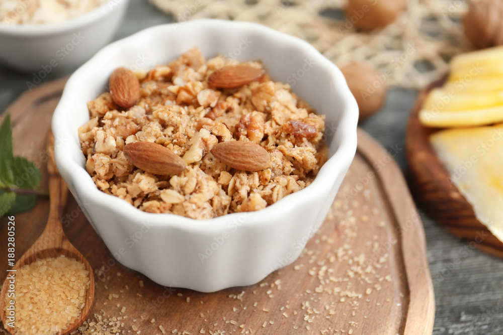 Ramekin with apple crisp on wooden board, closeup Ramekin with apple crisp on wooden board, closeup