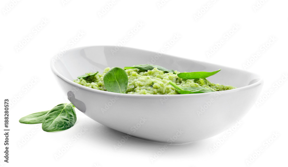 Dish with tasty spinach risotto on white background Dish with tasty spinach risotto on white background