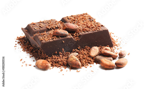 Piece of chocolate and cocoa beans on white background