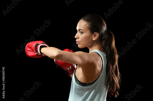 Strong woman in boxing glov...