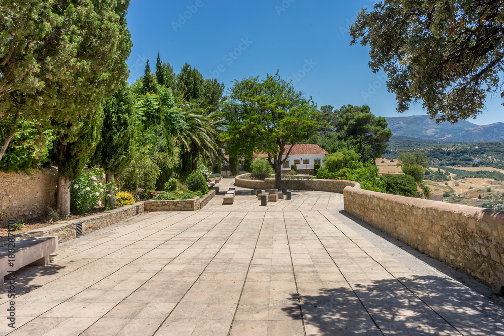 The walking path on Tajo De Ronda in the city of Ronda Spain, Europe on a hot summer day with clear blue skies