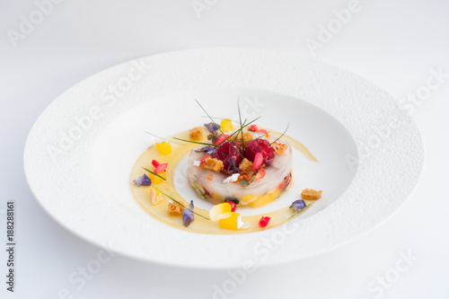 Photography scallop carpaccio with raspberries