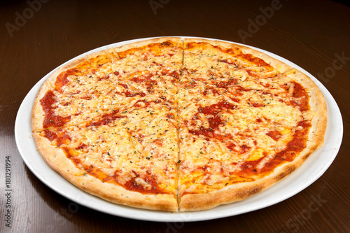 Pizza on a table on a round plate