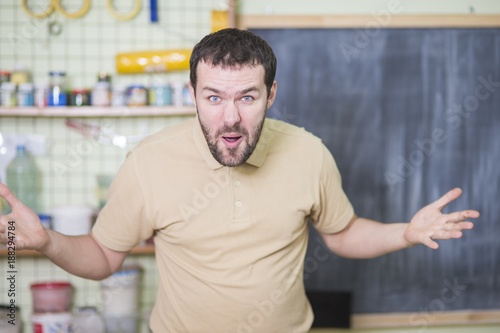 Portrait of Surprised and Exclaiming Caucasian Man Inside of Workshop