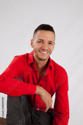 Happy man in red shirt smiling