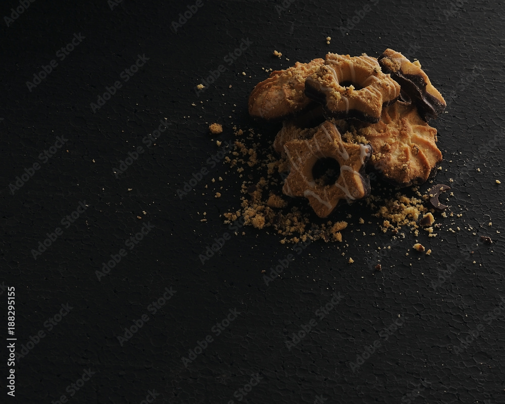stack of cookies on a black background stack of cookies on a black background