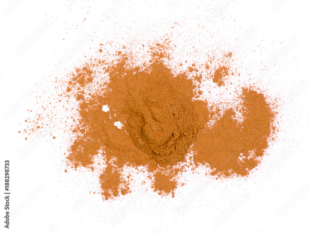 Pile of ground cinnamon on a white background