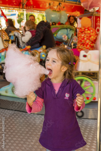 child on kirtag with cotton candy