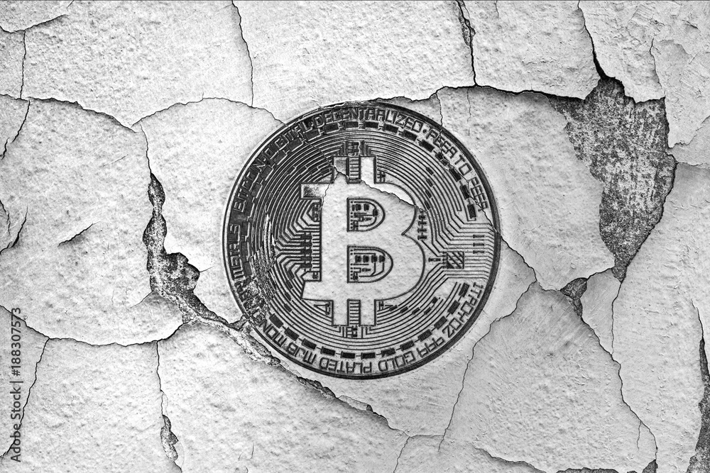 an old broken wall with bitcoin symbol