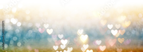 Beautiful shiny hearts and abstract lights background