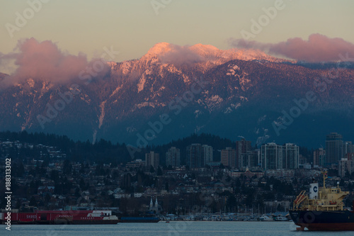 North Vancouver view from Stanley Park. City view with glacial mountain background. Sunset in Vancouver. © kaiyhun