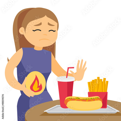 Caucasian white woman standing near table with fast food and having stomach ache from heartburn. Girl suffering from heartburn after fast food. Vector cartoon illustration isolated on white background