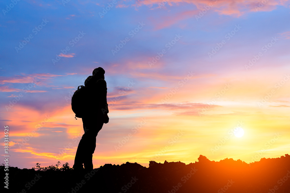 silhouette of man standing on the mountain,conceptual scene