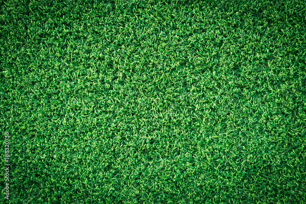 Obraz premium Green grass texture or green grass background for golf course. soccer field or sports background concept design. Artificial green grass.