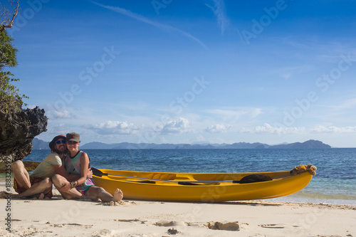 Couple canoeing in lagoon of West French indies