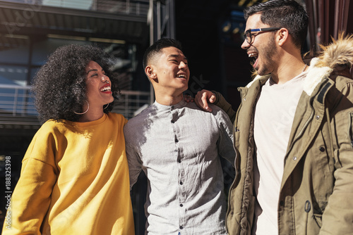 Group of happy having fun in the street. photo