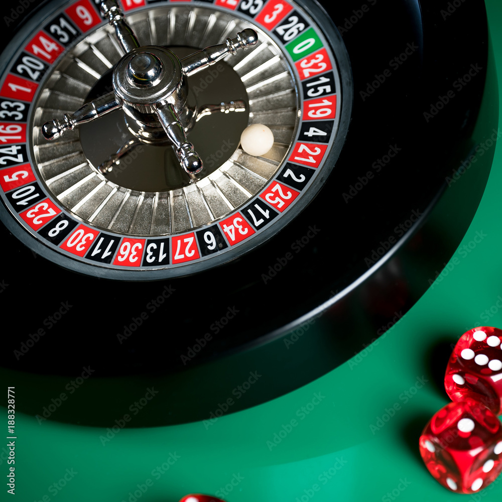 High contrast image of casino roulette and poker chips on bokeh background. High contrast image of casino roulette and poker chips on bokeh background.
